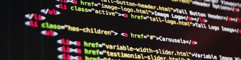 Close-up of complex website source code, illustrating the bloated backend code often found in DIY website builders.