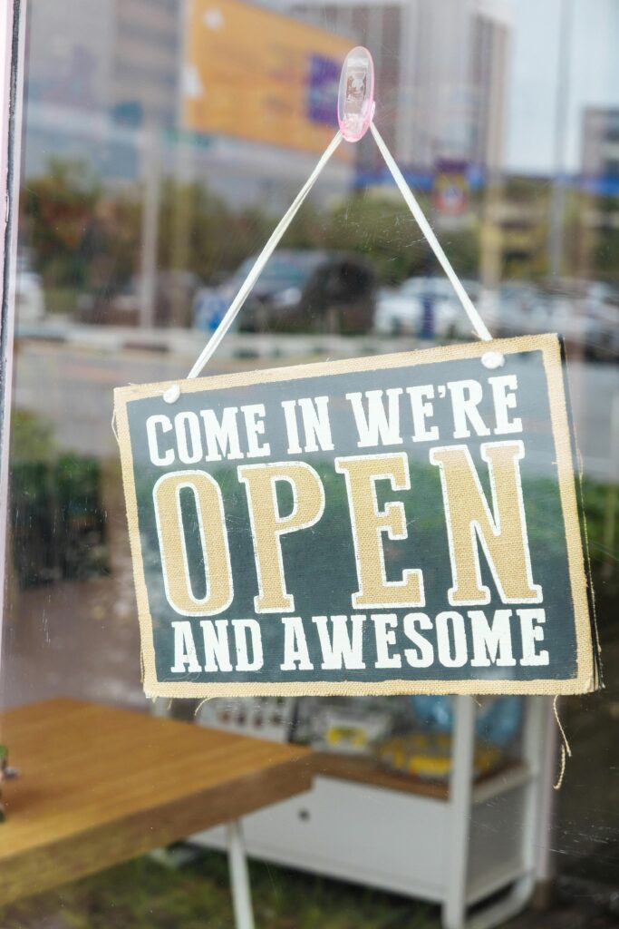 From Hometown Favorite to Digital Authority: Why Content is the Key to Local Growth A welcoming open sign on a small business storefront, symbolizing the digital open door for Minnesota business owners.